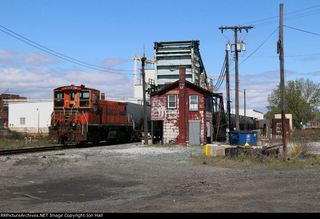 The old EJ&E Bridge 631 tower still stands guard as IHB's 114 Job passes